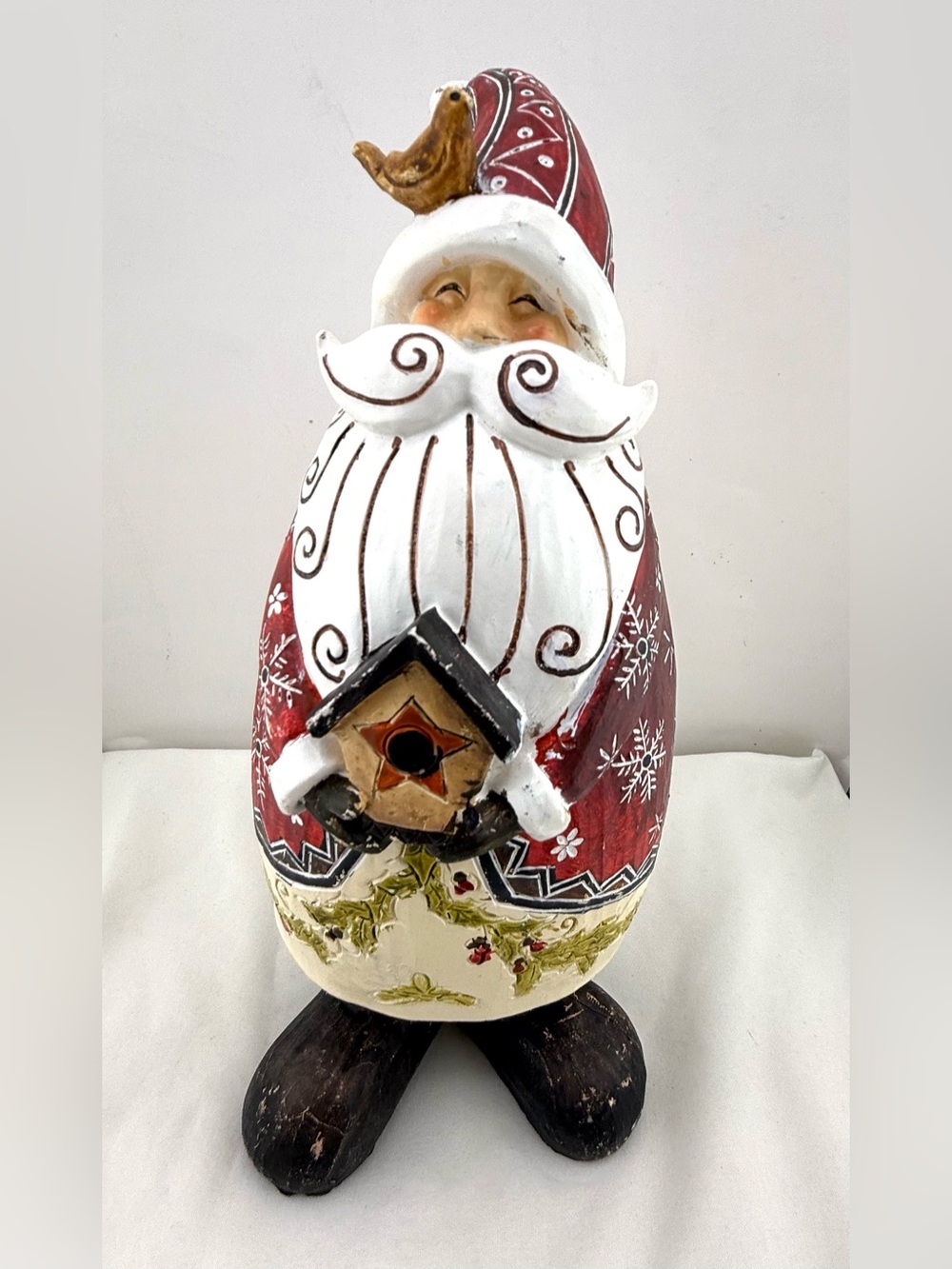 Folk art style resin Santa Claus figurine